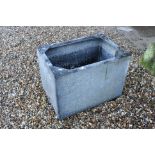 A vintage galvanised steel water container.