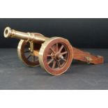 Bronze, Brass and Teak Desk Ornament in the form of a Canon, 38cms long