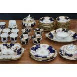 Extensive Early 20th century Coalport part Tea Set decorated with floral sprays on colbalt blue