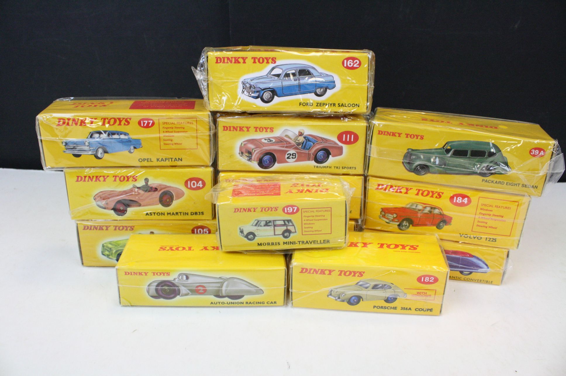 13 boxed Dinky Atlas Editions diecast models, all sealed, to include 23D Auto Union Racing Car,