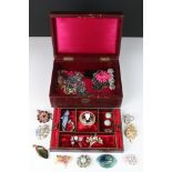 An antique jewellery box containing a small quantity of vintage costume jewellery including brooches