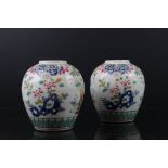 Pair of Chinese Porcelain Bulbous Vases with enamel floral decoration, 14cms high