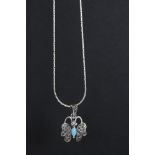Silver butterfly pendant necklace with turquoise body