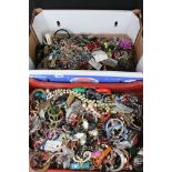 A large collection of vintage and contemporary costume jewellery contained within two boxes.