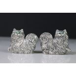 Pair of silver plated condiments in the form of long haired cats with emerald eyes
