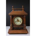 An antique wooden cased chiming bracket clock.