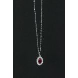 18ct white gold ruby and diamond pendant necklace of 1/2ct total weight
