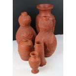 Five Chinese Terracotta Vases, all with dragon relief decoration including a Pair of Double Gourd