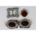 A small group of antique costume jewellery to include buckles and fob watch spinner.