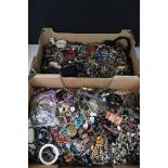 A large collection of mixed vintage and contemporary costume jewellery contained within two boxes.