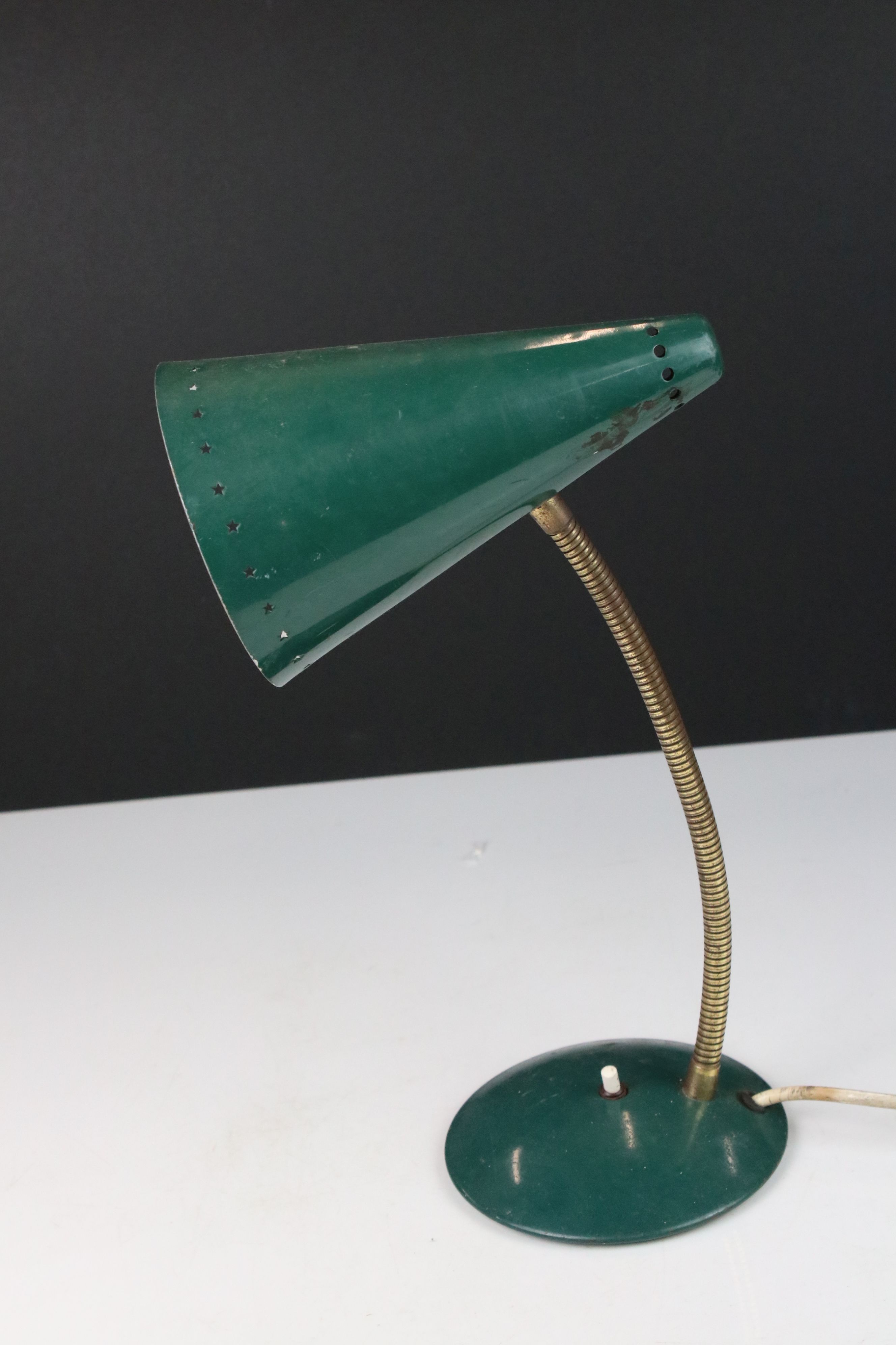 A mid century green adjustable table lamp.