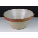 Large French Glazed Dairy Bowl with pouring lip, impressed mark to rim ' 12 ', 36cms diameter