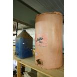 Two vintage paraffin storage cans to include Aladdin pink.