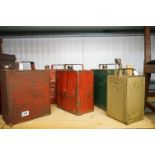 A collection of five vintage fuel cans to include Esso and Shell examples.