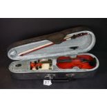 A small violin within a padded carry case, body measures approx 8.5".