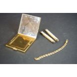 A bone folding ruler together with a ladies compact and a gold plated bracelet.