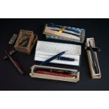 A collection of vintage pens to include Conway Stewart and Parker examples.