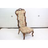 Victorian Walnut Prie Dieu Chair with carved entwined trellis sides and carved scroll legs on