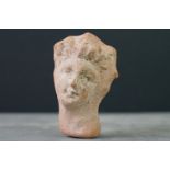 An ancient roman style clay head sculpture.