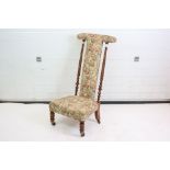 Victorian Prie Dieu Chair with twisted columns supports raised on castors, 103cms high