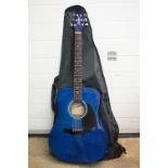 A blue six string Rider acoustic guitar with gig bag.