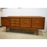 Mid 20th century style Teak and Veneer Sideboard with three drawers flanked to one side by two