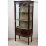 Edwardian Mahogany Bowfront Display Cabinet, the single glazed doors opening to three fabric lined