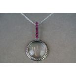 Silver pendant magnifying glass set with semi precious stones