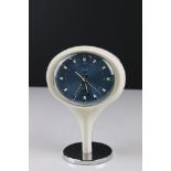 Mid century Presta Jupiter Mantle Clock with a blue face and raised on an atomic form base, 19cm