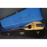 A vintage cased Il Globo Mandolin.