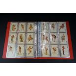 A collection of vintage erotic playing cards together with adult glamour collectors cards