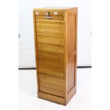 Edwardian Oak Stationary / Filing Cabinet, the drop down tambour front opening to shelves, with key,