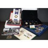 A collection of mainly British commemorative coins to include a year set.