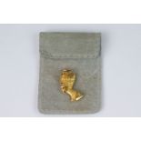 A 18ct gold pendant in the form of Egyptian Queen Nefertiti.