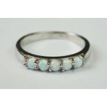 Silver and opal five stone ring