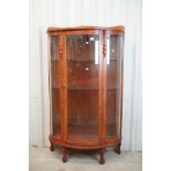 Early to Mid 20th century Oak Demi-lune Display Cabinet, the single door opening to three adjustable