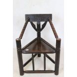 19th century Carved Oak Turner Elbow Chair with geometric carved back rail, ringed turned arms,