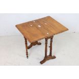 Small 19th century Mahogany Sutherland Table raised on turned twin pillar supports, 49cm wide x 50cm
