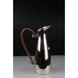 Wine ewer with stylized leather handle