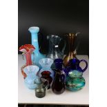 Thirteen items of Coloured Glass including Whitefriars Ruby Red Jug, Mdina Squat Vase, Bristol