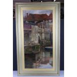 1902 oil on canvas, town view with half timbered buildings and men on bridge with punts below,