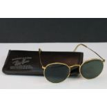 A pair of vintage Ray-Ban sunglasses.