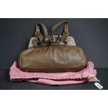 A brown Radley handbag with colourful detailing, brown Radley dog and pink dust bag.