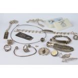 A collection of mainly silver jewellery to include rings, bracelets and coin purse.