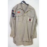 A 1940's boy scouts shirt with various original badges