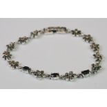 Silver line bracelet set with cabochon sapphires