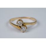 18ct yellow gold two stone diamond crossover ring of 20 points approx.