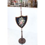 19th century Mahogany Pole Screen, the shield shape screen with needlework panel, 148cm high