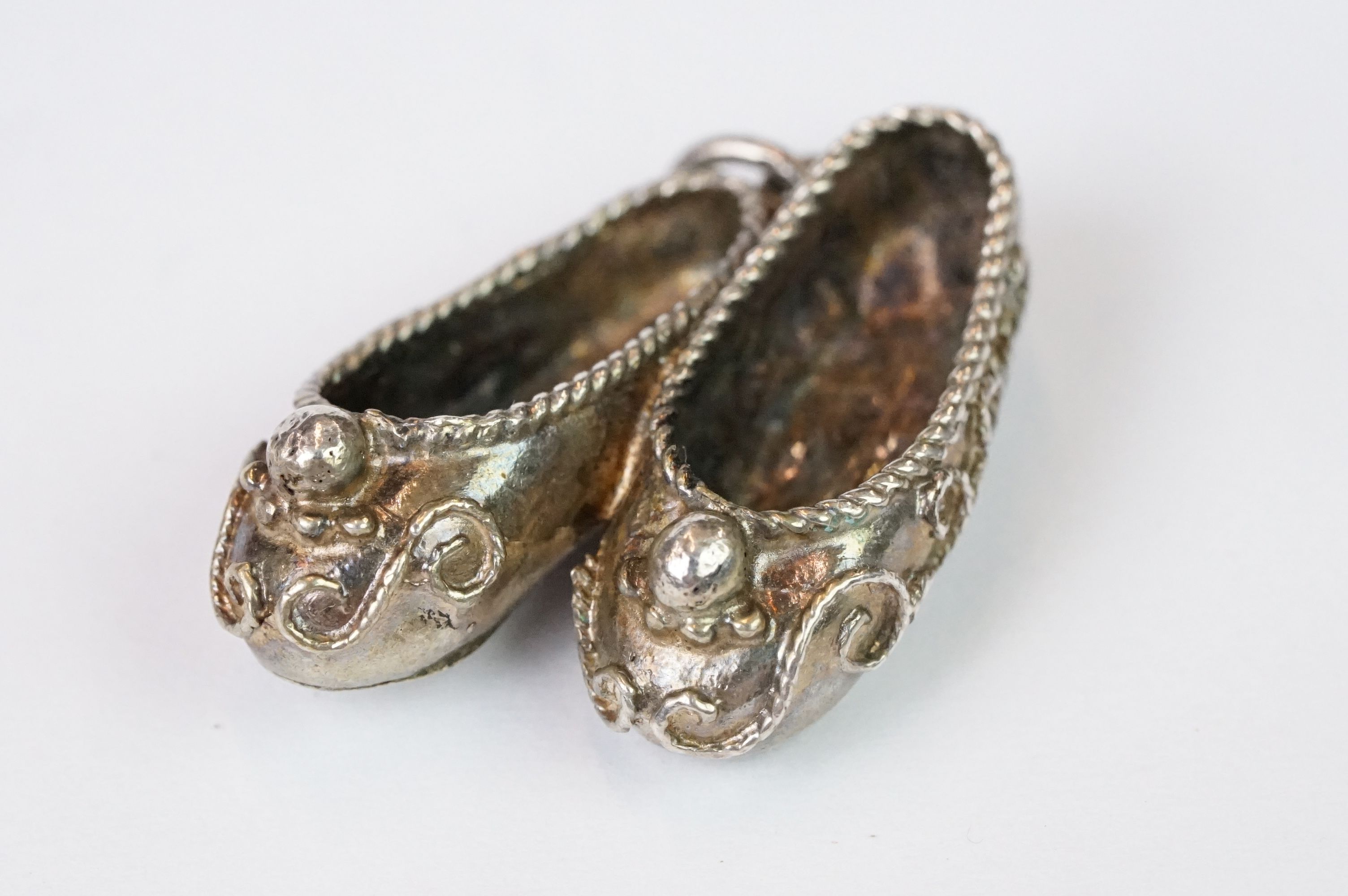 White Metal Pendant in the form of Two Shoes, 3cm long