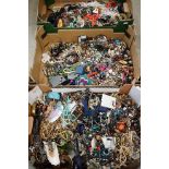 A large collection of vintage and contemporary costume jewellery contained within three boxes.